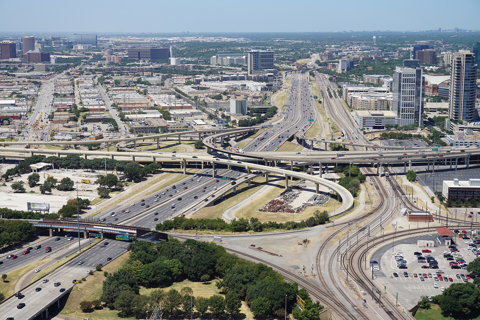 An elevated view of the multi-level Interstate 35E interchange in Dallas, Texas, with roads fanning out across the city.